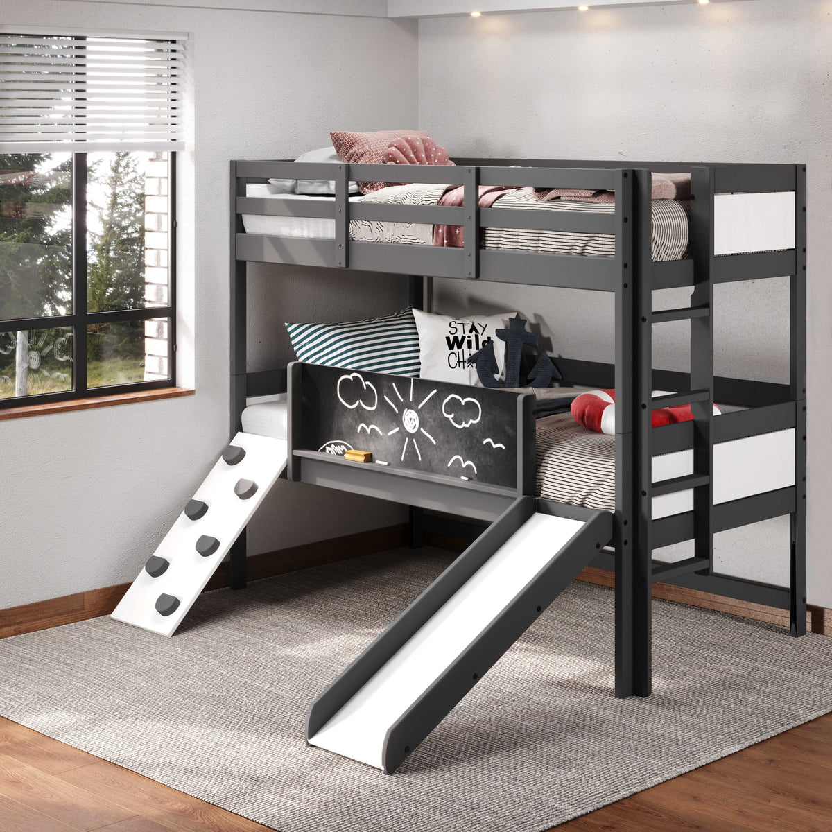 Custom Kids Furniture Ophelia Bunk Bed with Slide & Climbing Wall shown in a bright room with bedding and playful decor, perfect for boys or girls.