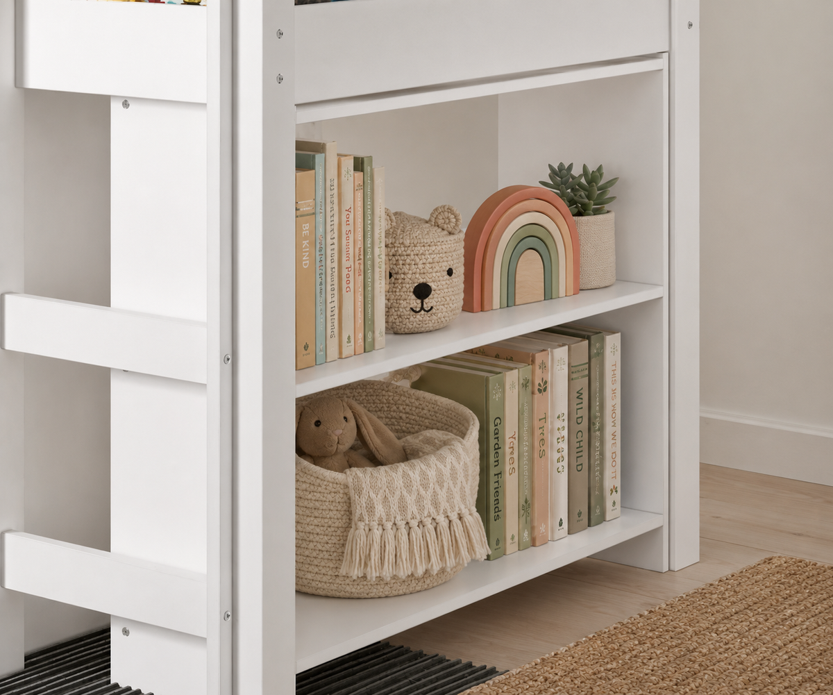 White bookshelf for kids under low loft bed with books, a plant, and decorative items against a neutral wall.
