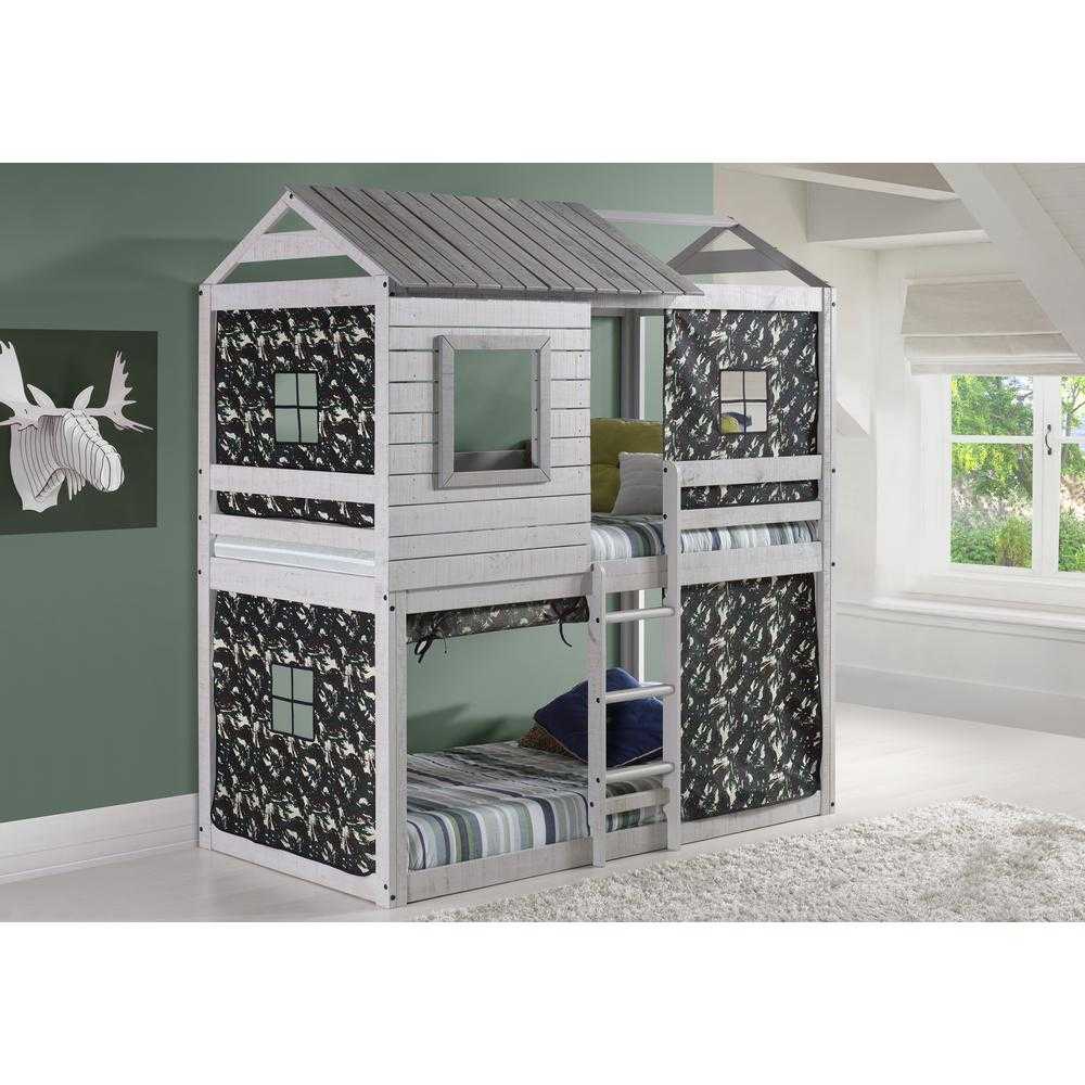 Jackson Fort Bunk Bed with Camo Tent shown in a kids' bedroom, highlighting its rustic wood finish, ladder access, and playful fort-style structure.