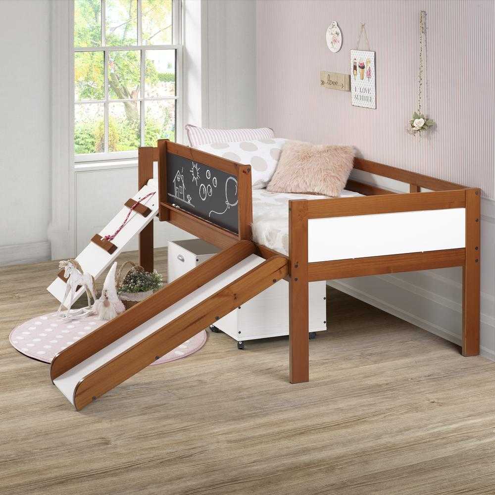 Oliver Low Loft Bed with Slide in walnut and white finish, featuring chalkboard panel, angled slide, and ladder in a pink-themed kids room.