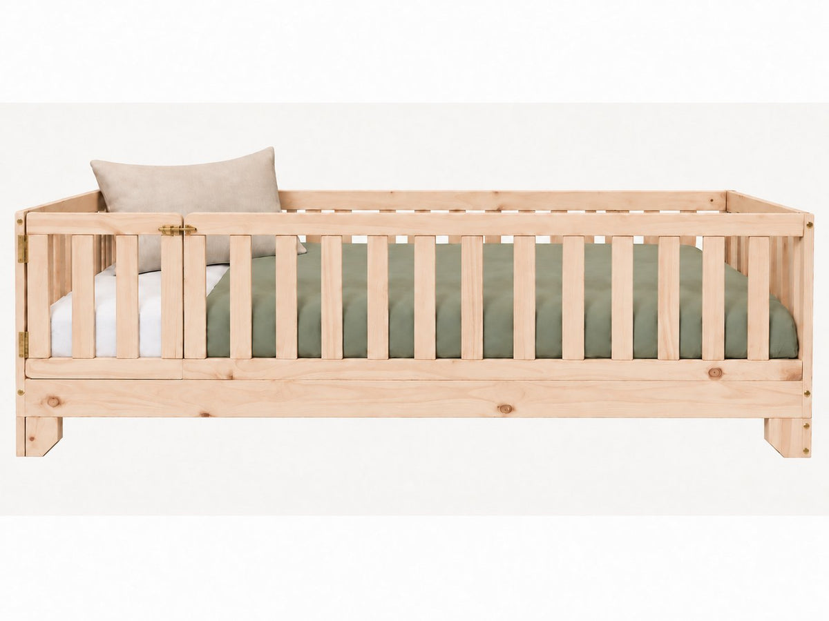 Luca Montessori twin size floor bed with a natural finish, rails and a gate for toddlers.
