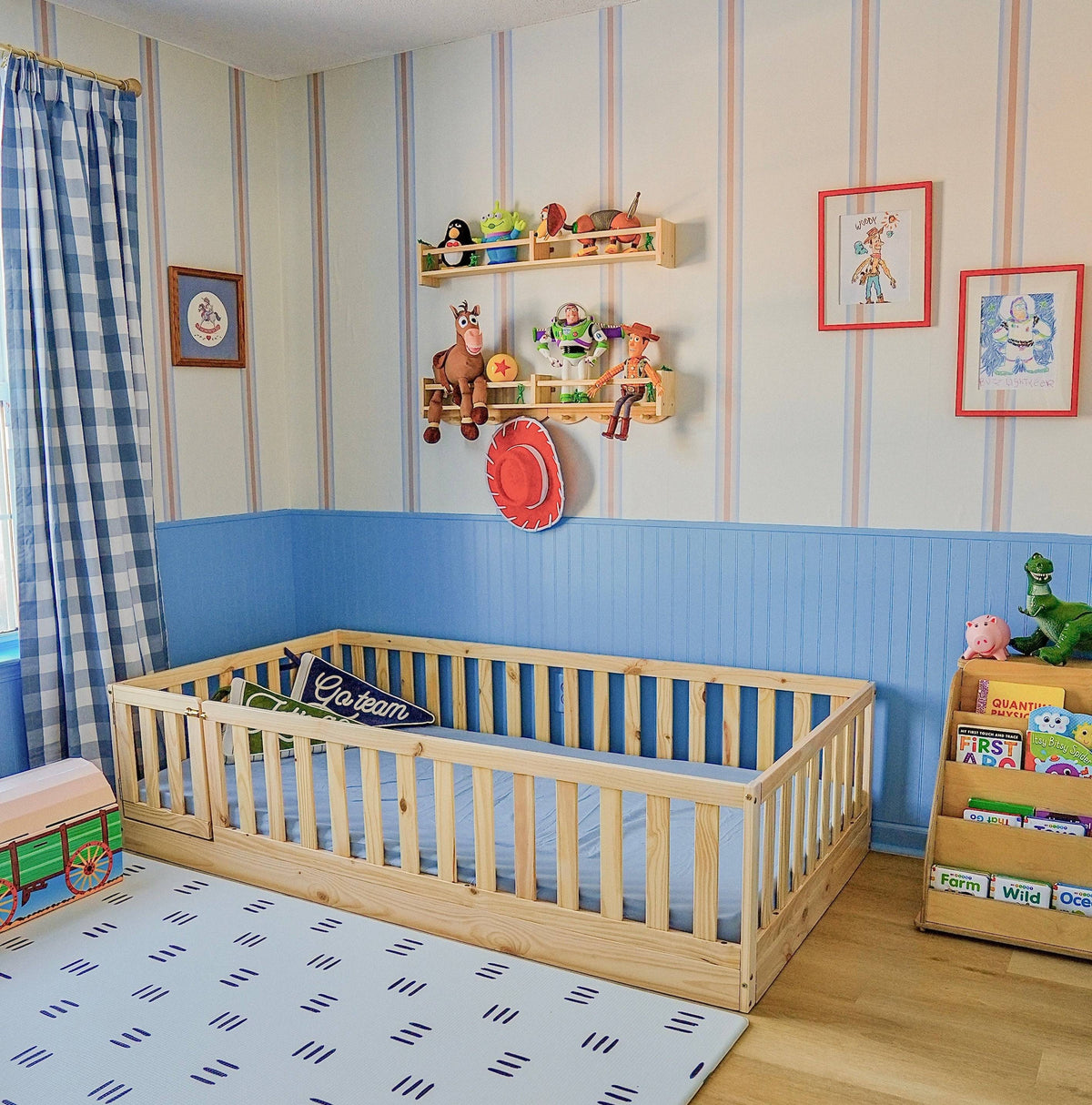 Gianna Convertible Toddler Floor Bed with Gate in Toy Story Themed Bedroom