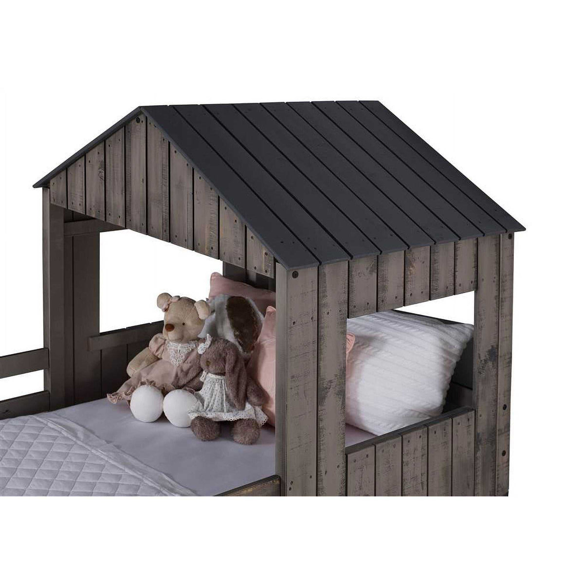 Close-up of Rory Camp Out Bunk Bed's top twin bunk with dark wood roof and plush toys, showcasing detailed craftsmanship and playful design for kids.