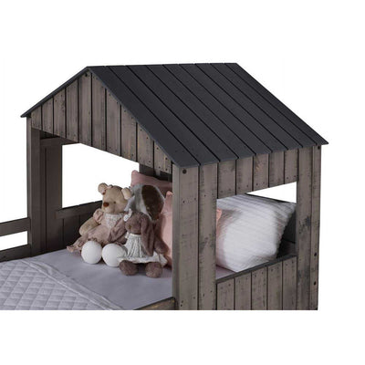 Close-up of Rory Camp Out Bunk Bed's top twin bunk with dark wood roof and plush toys, showcasing detailed craftsmanship and playful design for kids.