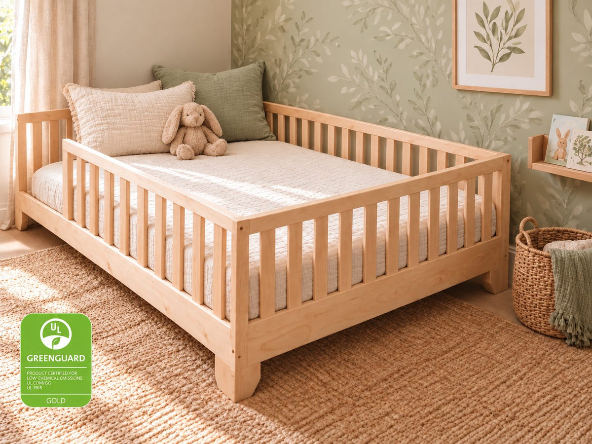 Luca natural full-size toddler floor bed with rails in a sage botanical bedroom