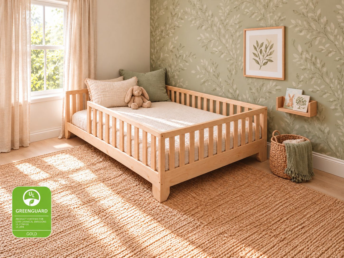 Greenguard Gold Certified Luca natural full-size toddler floor bed with rails in a sage botanical bedroom