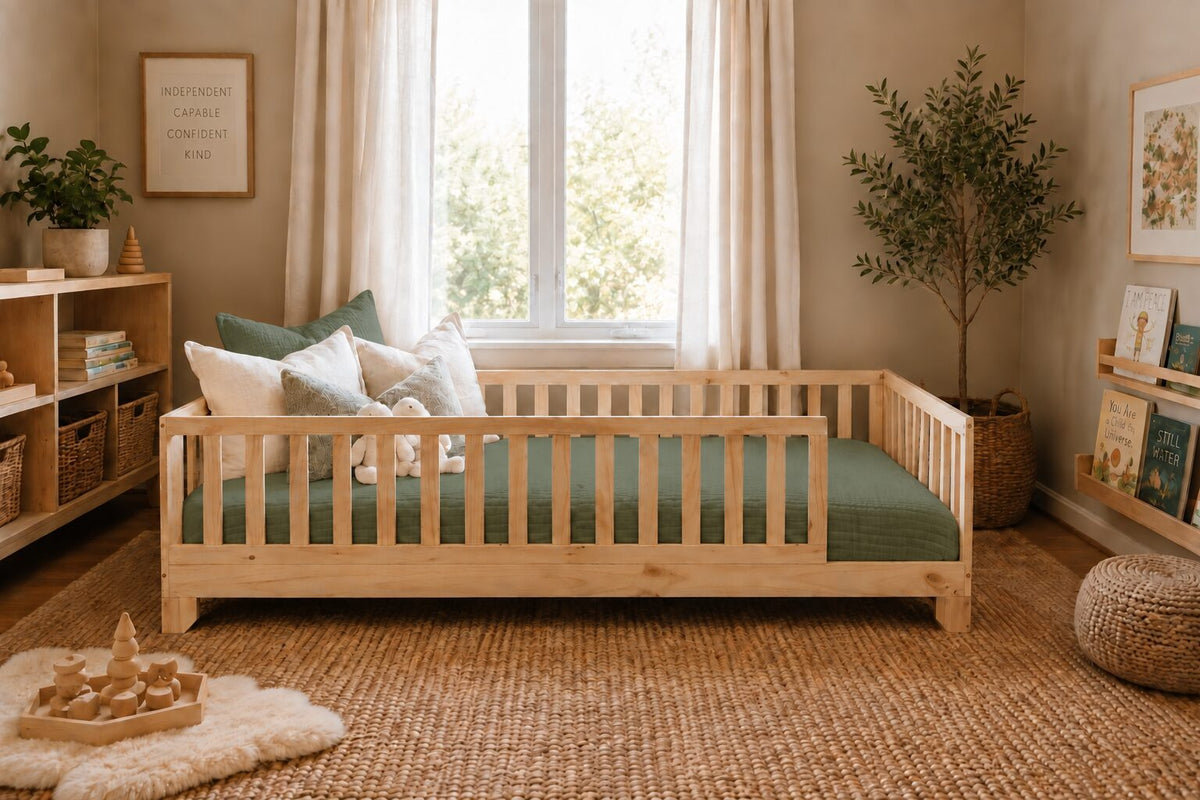 Fern green cotton muslin comforter on a natural pine Luca Montessori floor bed in a toddler room